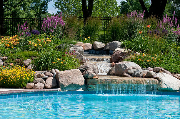 Beautifully Landscaped Backyard Pool With A Waterfall.